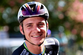 Remco Evenepoel smiles before stage 14