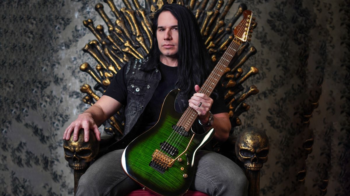 Max Carlisle holds his new signature Harley Benton Fusion guitar