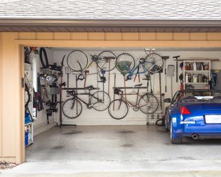 garage with car and bikes hung on the wall