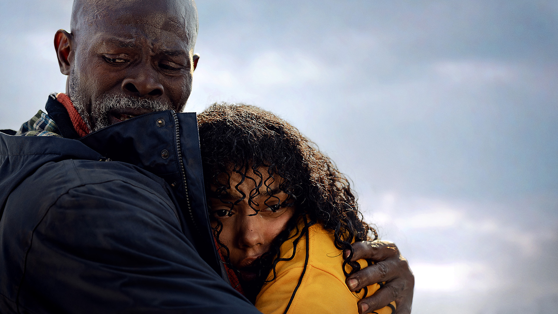 Djimon Hounsou as Dr. Dale Edwards and Whitney Peak as Dakota in Thrash.