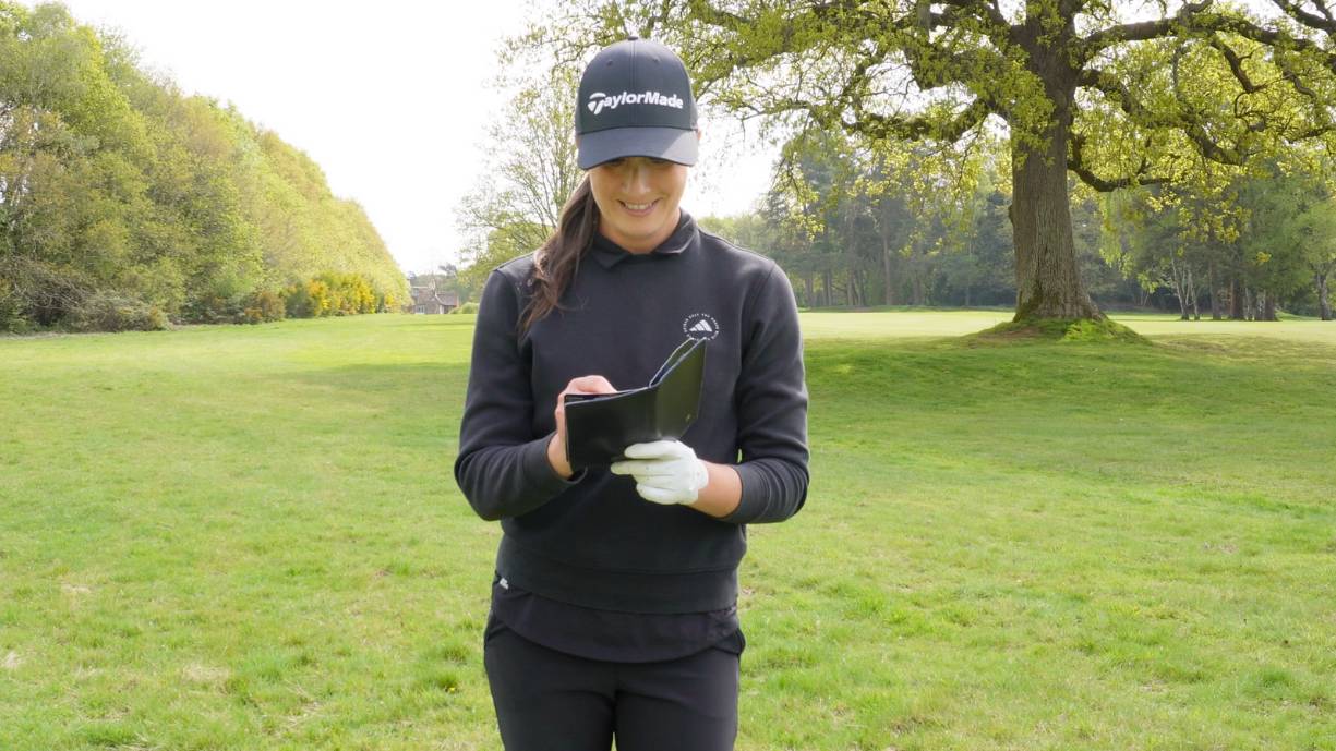 Jess Ratcliffe marking a scorecard