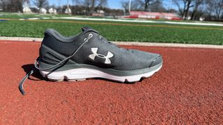 a photo of the Under Armour Charged Gemini running shoe from the side