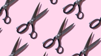 Repeated vintage scissors on pink background