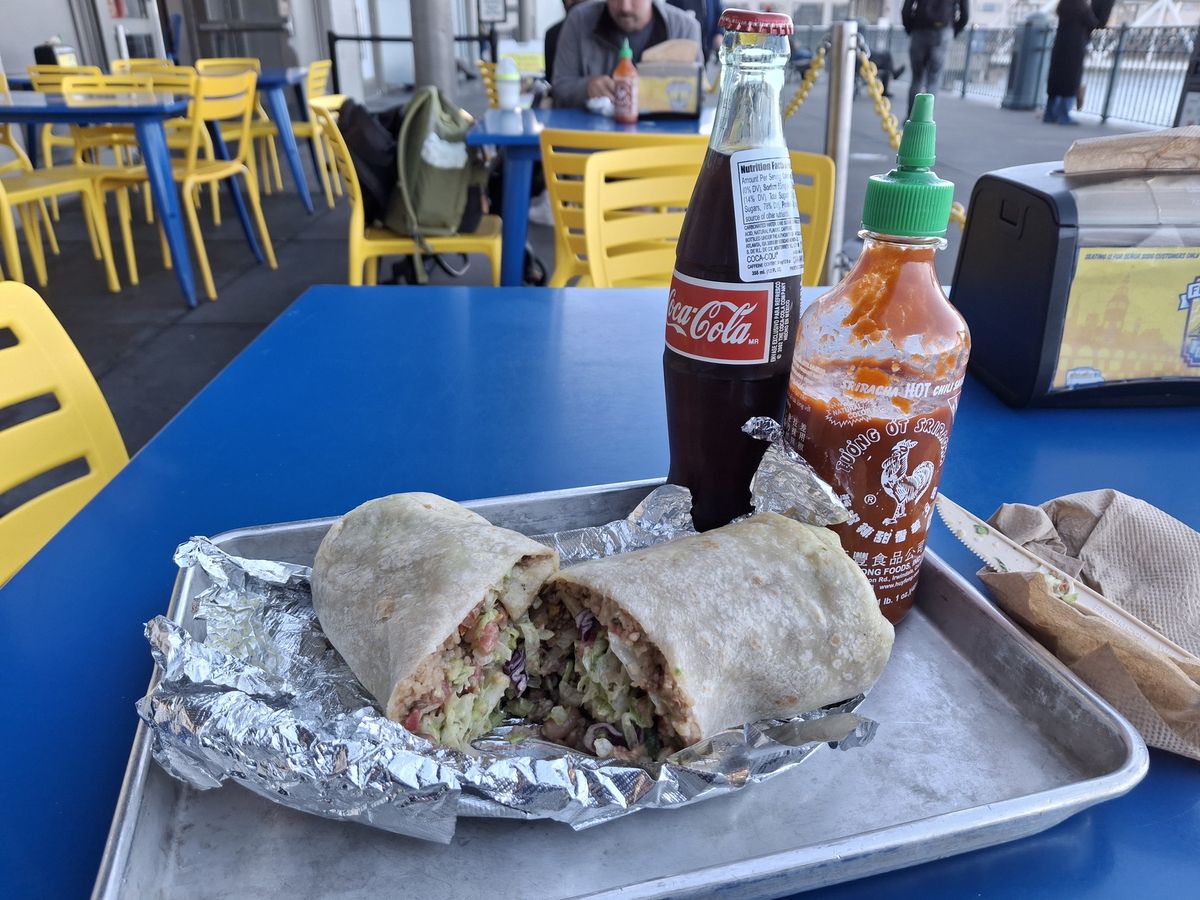 Shot of a burrito with coke and hot sauce shot by a Galaxy A35