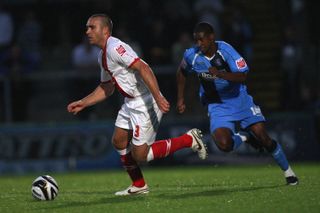 Wycombe Wanderers' Gavin Grant (right) chases Birmingham City's David Murphy in a Carling Cup clash in August 2008.