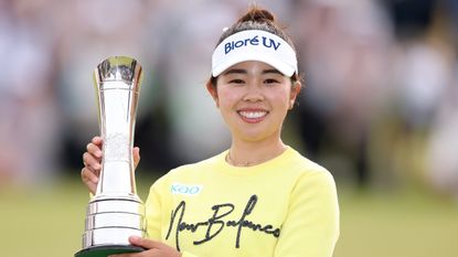 Miyu Yamashita of Japan poses for a photo with the trophy following the final round of the AIG Women's Open 2025 at Royal Porthcawl Golf Club on August 03, 2025 in Bridgend, Wales