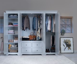 triple doored freestanding wardrobes open showing content