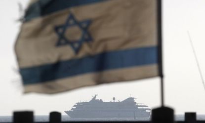 The Turkish vessel Mavi Marmara is escorted after a deadly raid by Israeli marines May 31, 2010: The UN exonerated Israel this week for the assault.
