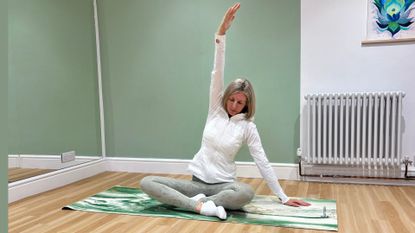 Kathryn Williams stretching while doing 20 minutes of yoga 