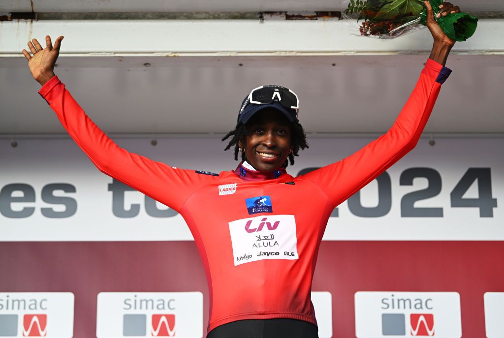 EDE NETHERLANDS OCTOBER 11 Teniel Campbell of Trinidad and Tobago and Team Liv AlUla Jayco celebrates at podium as Red most combative rider jersey winner during the 26th Simac Ladies Tour 2024 Stage 4 a 1182km stage from Ede to Ede UCIWWT on October 11 2024 in Ede Netherlands Photo by Luc ClaessenGetty Images