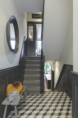 dark wall panelling in hallway and stairway