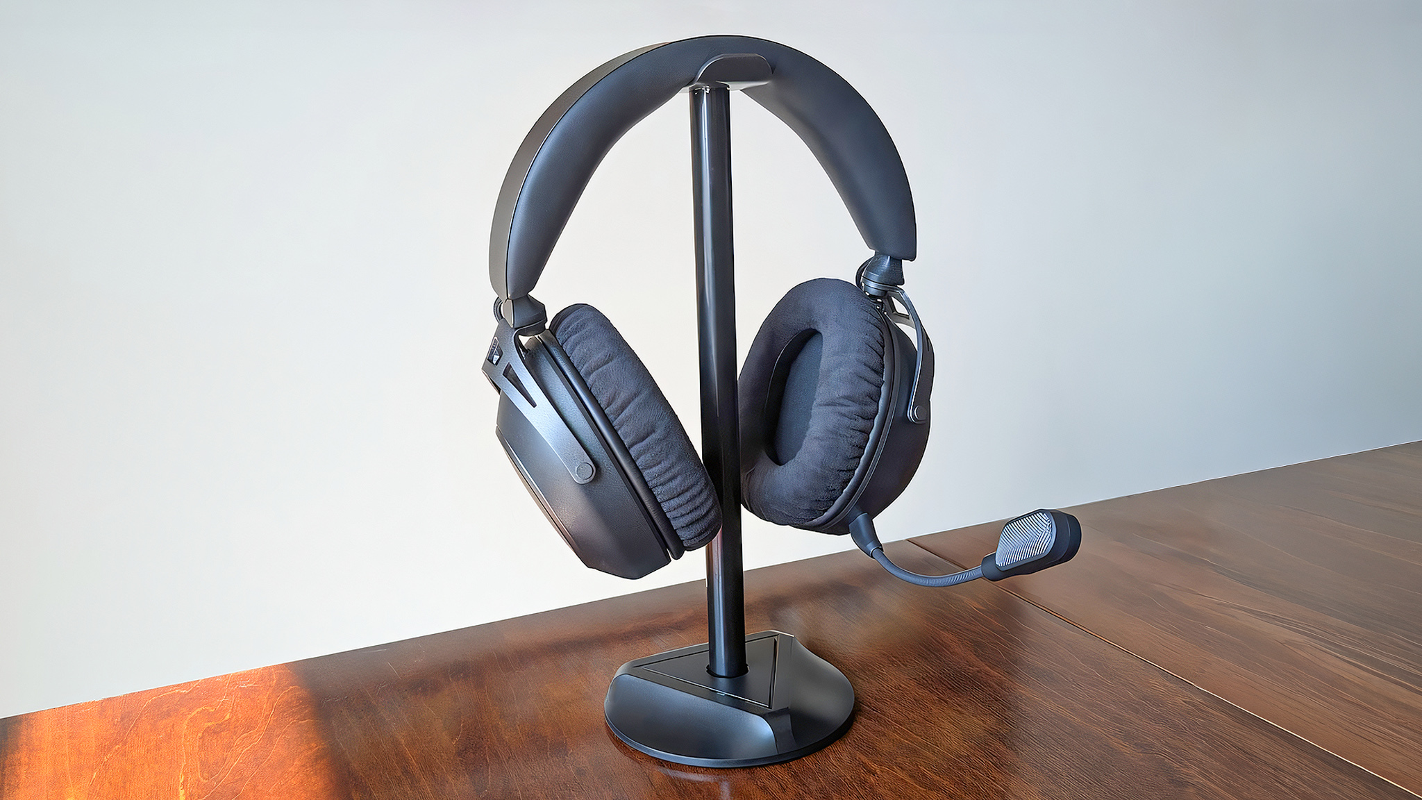 The HyperX Cloud Alpha 2 Wireless gaming headset resting on a headset stand. 