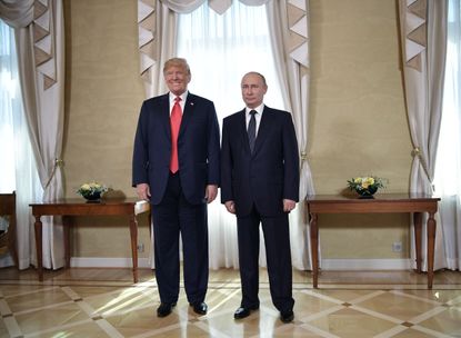 Putin and Trump pose in Helsinki