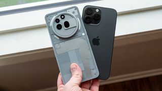 A Nothing Phone 3a Pro and an iPhone 14 Pro Max