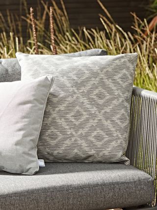 outdoor cushions on a garden sofa