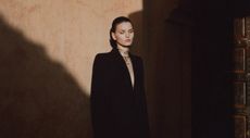 Model wears black in summer in Moroccan hotel