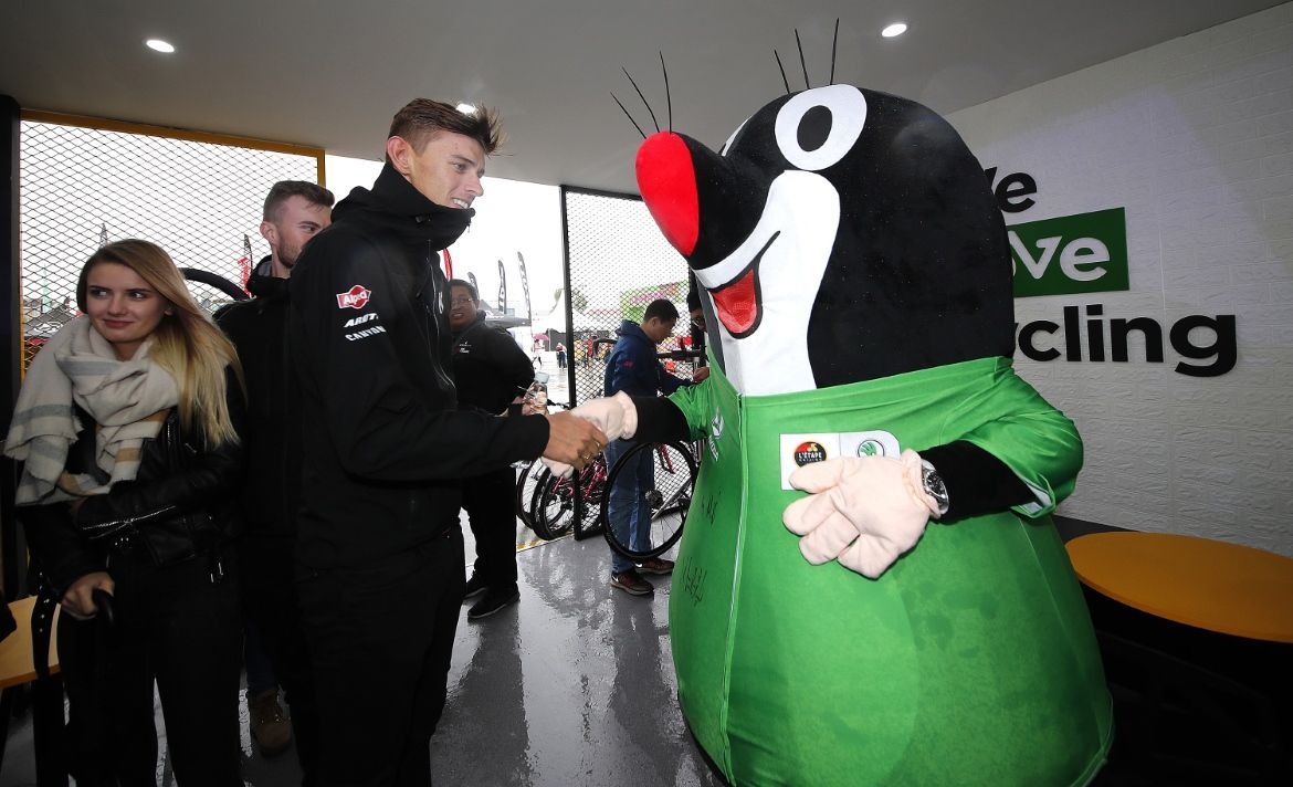 Nils Politt shakes hands with a... well we're not entirely sure what it is