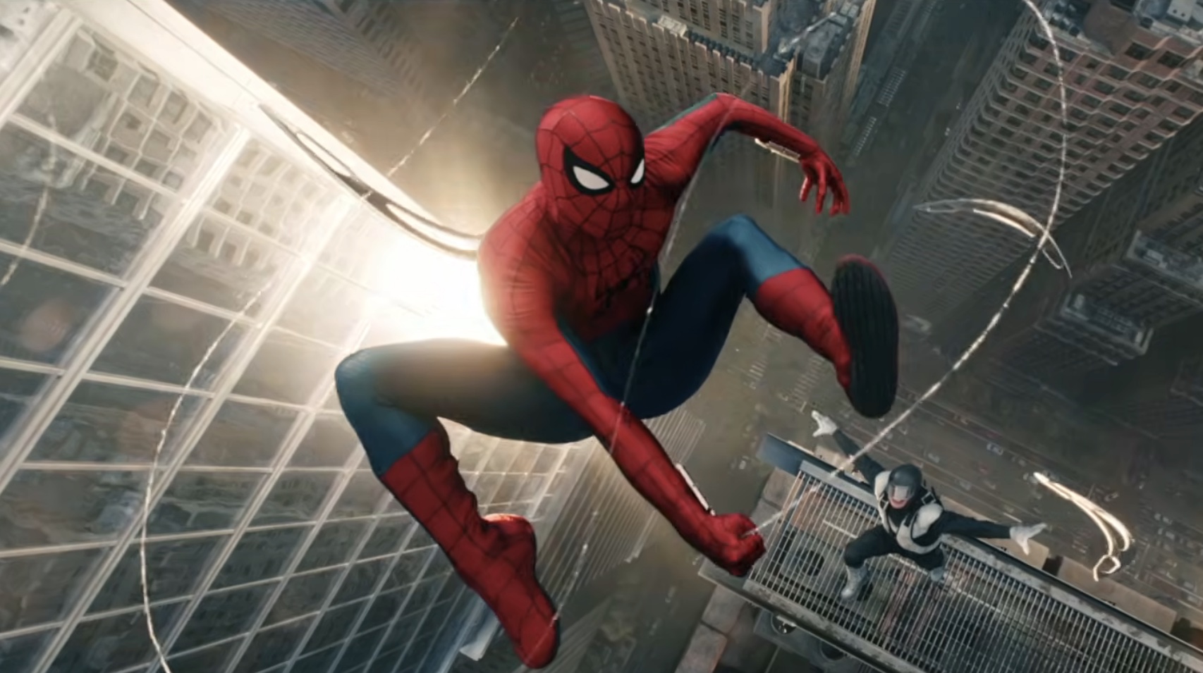 Spider-MAn in the air with a web string as a masked foe throws weapons at him.