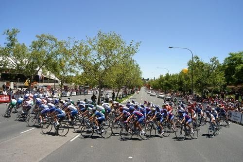 The peloton rounds the first bend
