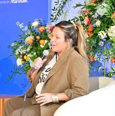 Laura Correnti, founder and CEO of Deep Blue Sports + Entertainment, speaking on stage at Marie Claire’s Power Play summit in Philadelphia.