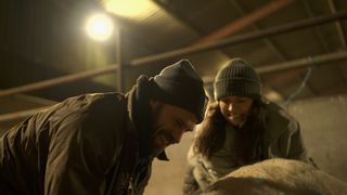 Kelvin and Liz Fletcher help a sheep in Fletchers' Family Farm