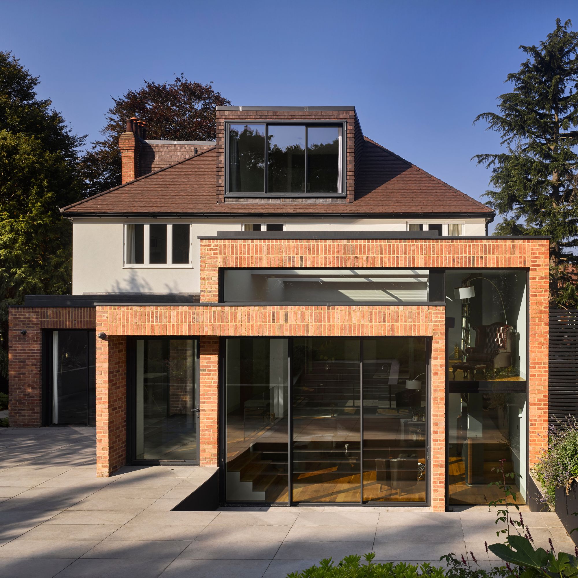 Property with contemporary extension and a hipped roof
