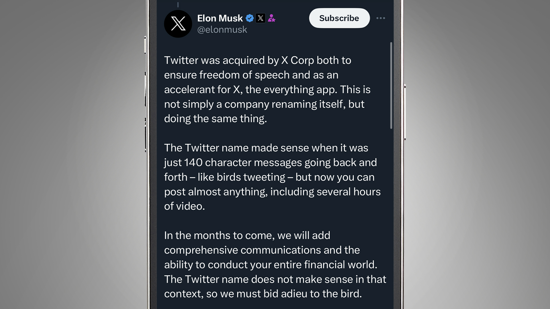A phone screen on a grey background showing a Tweet from Elon Musk