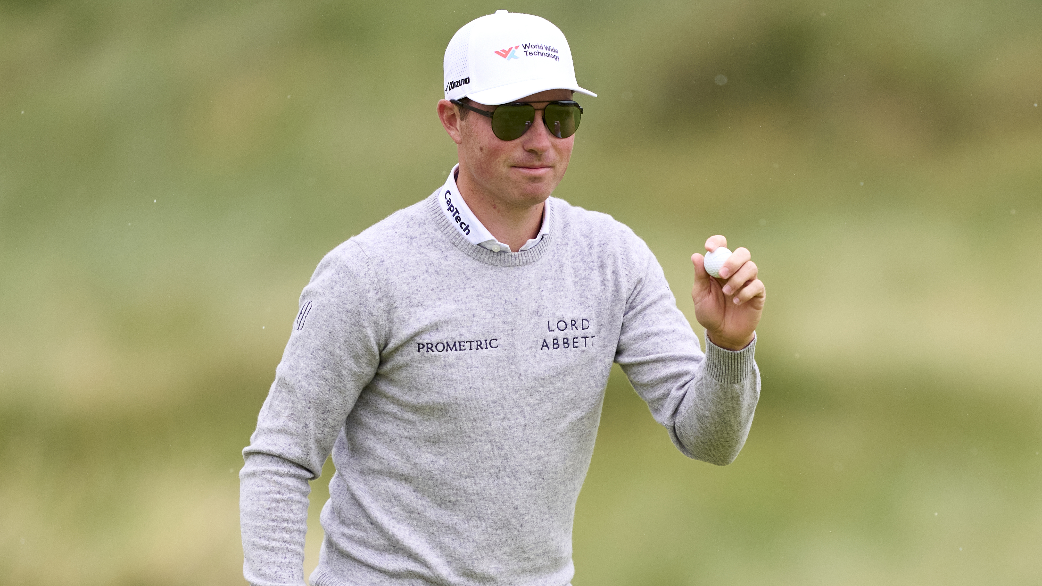 Photo of Ben Griffin holding a golf ball