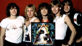 English musicians Rick Allen, Phil Collen, Rick Savage, Steve Clark (1960 - 1991) and Joe Elliott, of the English rock band Def Leppard, pose for a group portrait during the 1987 Hysteria Tour at the Joe Louis Arena in Detroit, Michigan, November 2, 1987