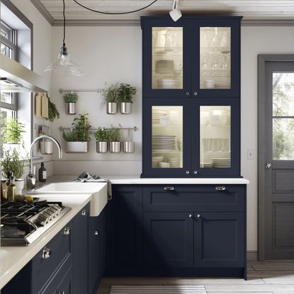 IKEA navy kitchen with white marble worktops