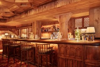 Wood-lined bar at Loulou Courchevel