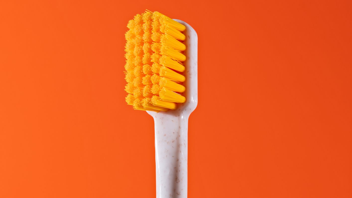 orange colored toothbrush