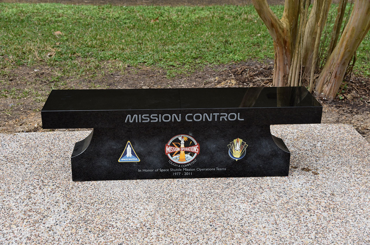 Unlike the other two benches, the mission operations patch at the center of the space shuttle monument displays the insignia as it was updated for the later flight program, 1981 to 2011.