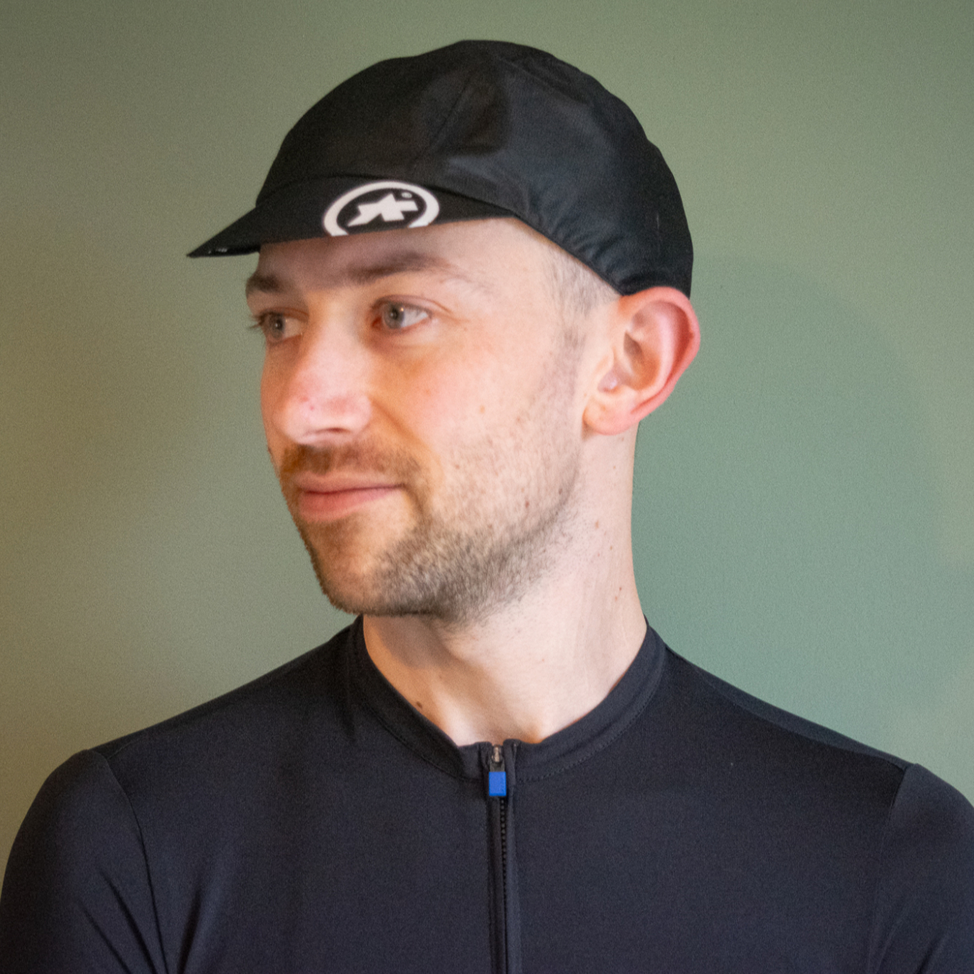 Assos Rain Cap being worn by a white male