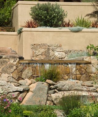 Stone water feature in garden