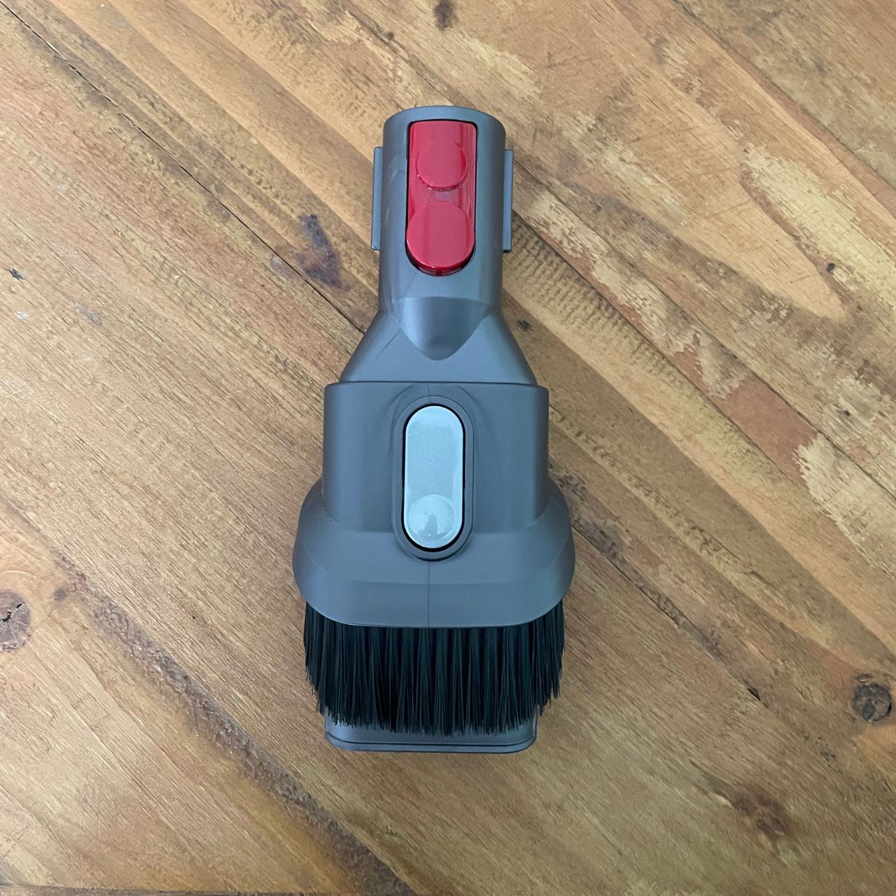 Dyson combination tool on a wooden table