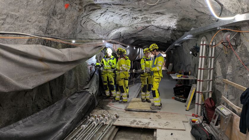Researchers work in an underground stone tunnel