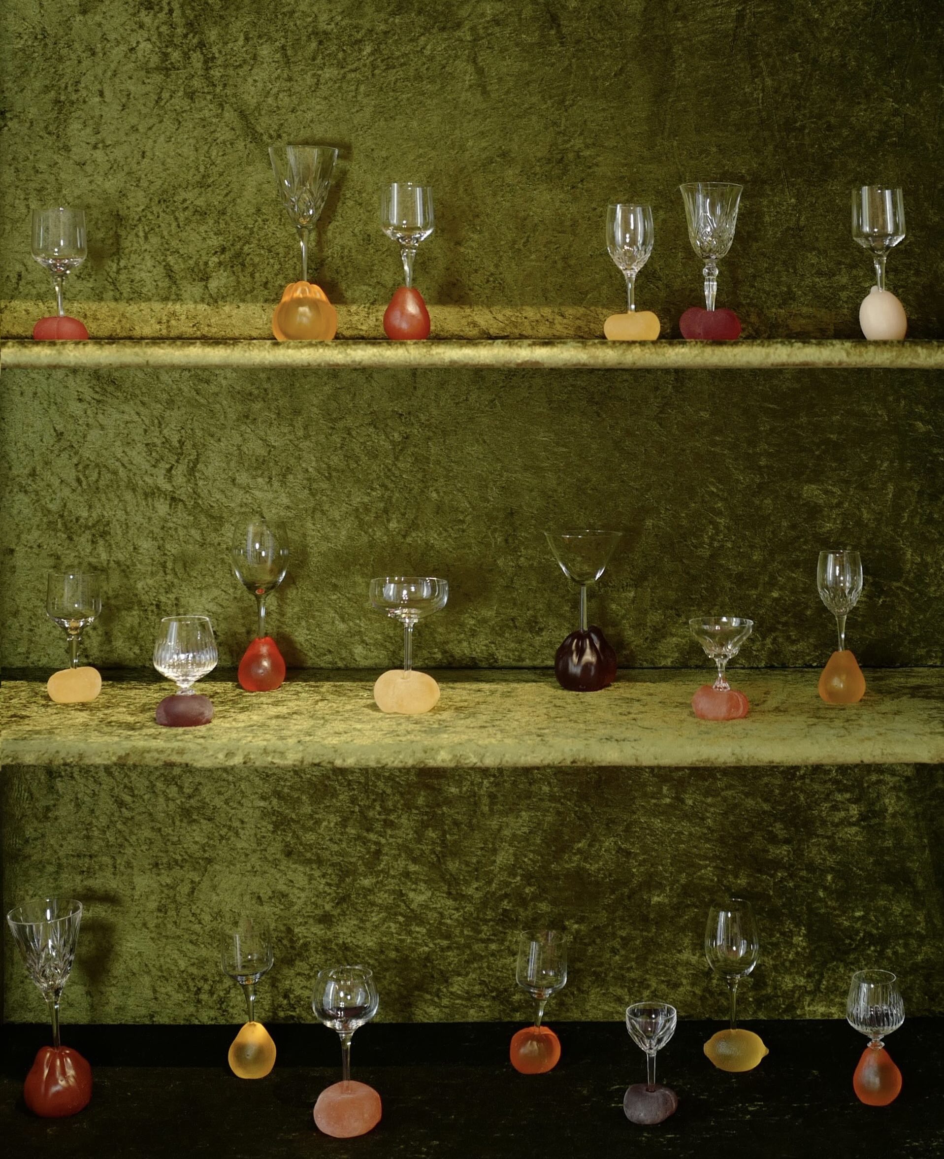 Glasses arranged inside a wooden cabinet