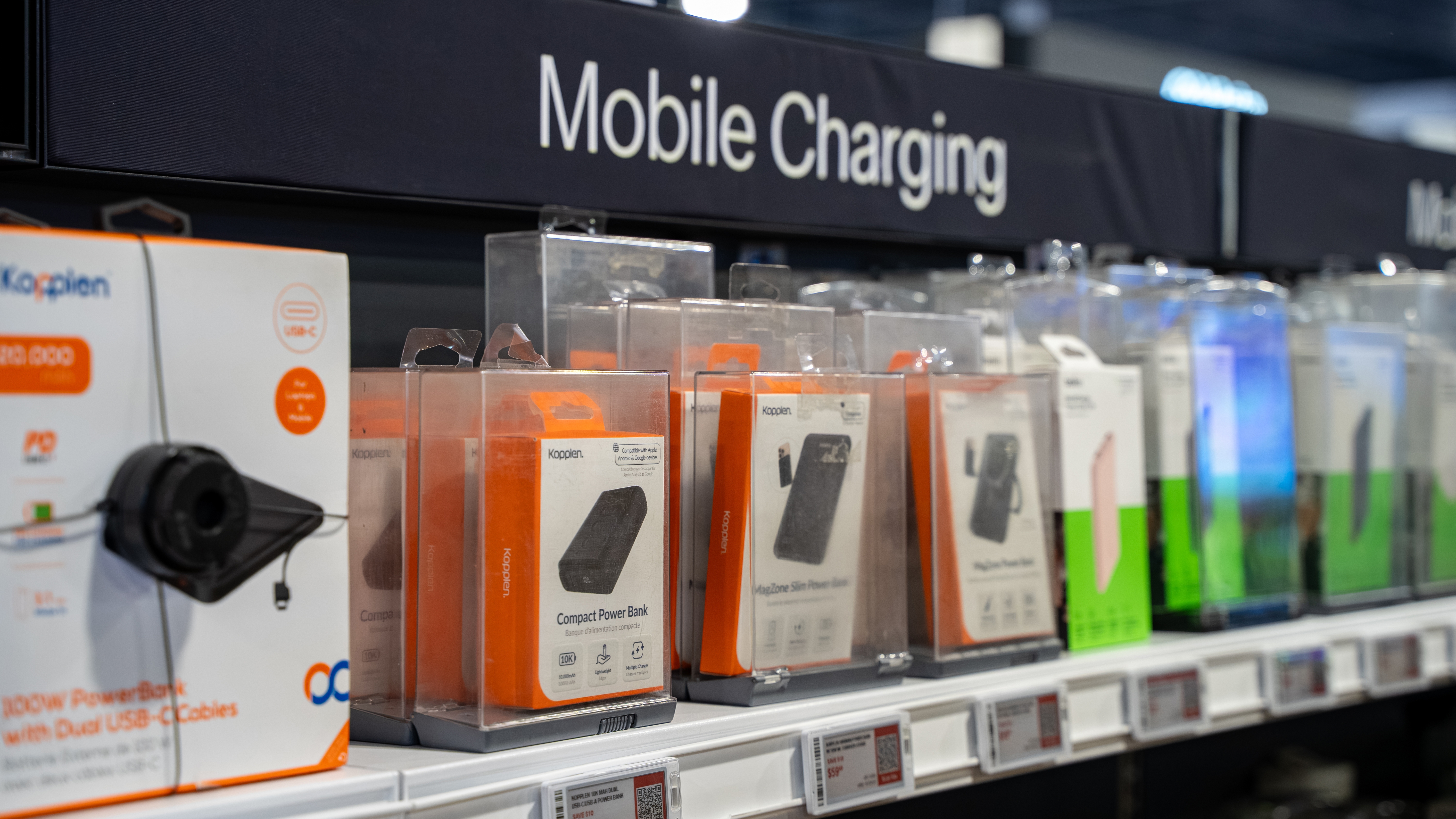 A rack of mobile charging accessories in a store