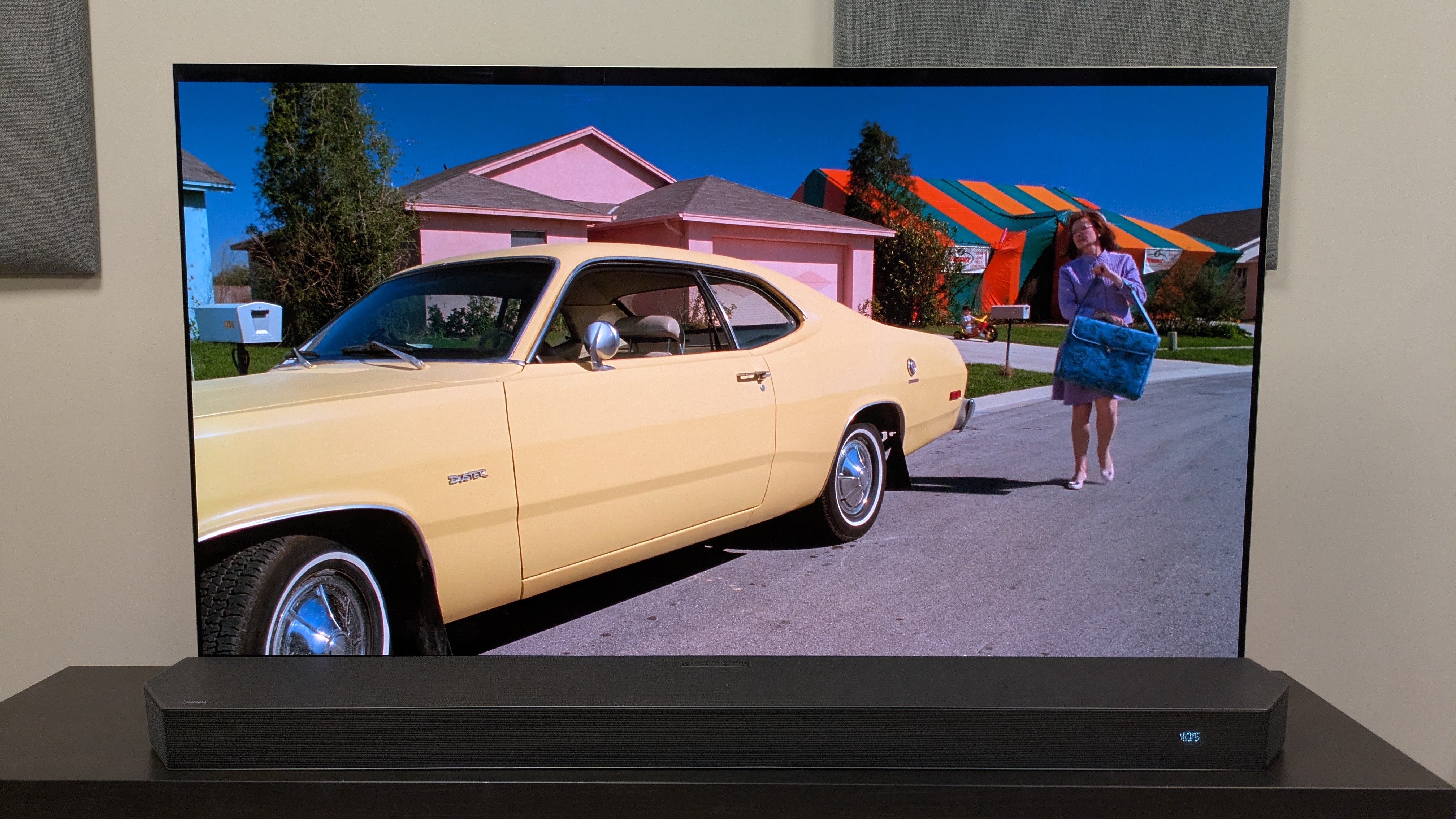 Edward Scissorhands 4K Blu-ray showing a yellow car and colorful houses on LG G5 