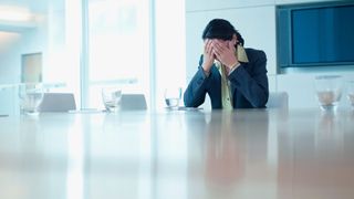 woman stressed in her kitchen