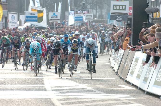 Marcel Kittel (Team Argos-Shimano), right, and Mark Cavendish (Omega Pharma-QuickStep) throw their bikes at the line