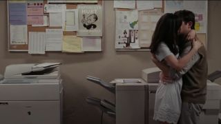 Summer and Tom kissing in the copy room