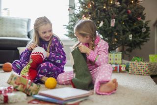 Children opening gifts on Boxing Day 2020