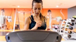 young woman working out on a treadmill