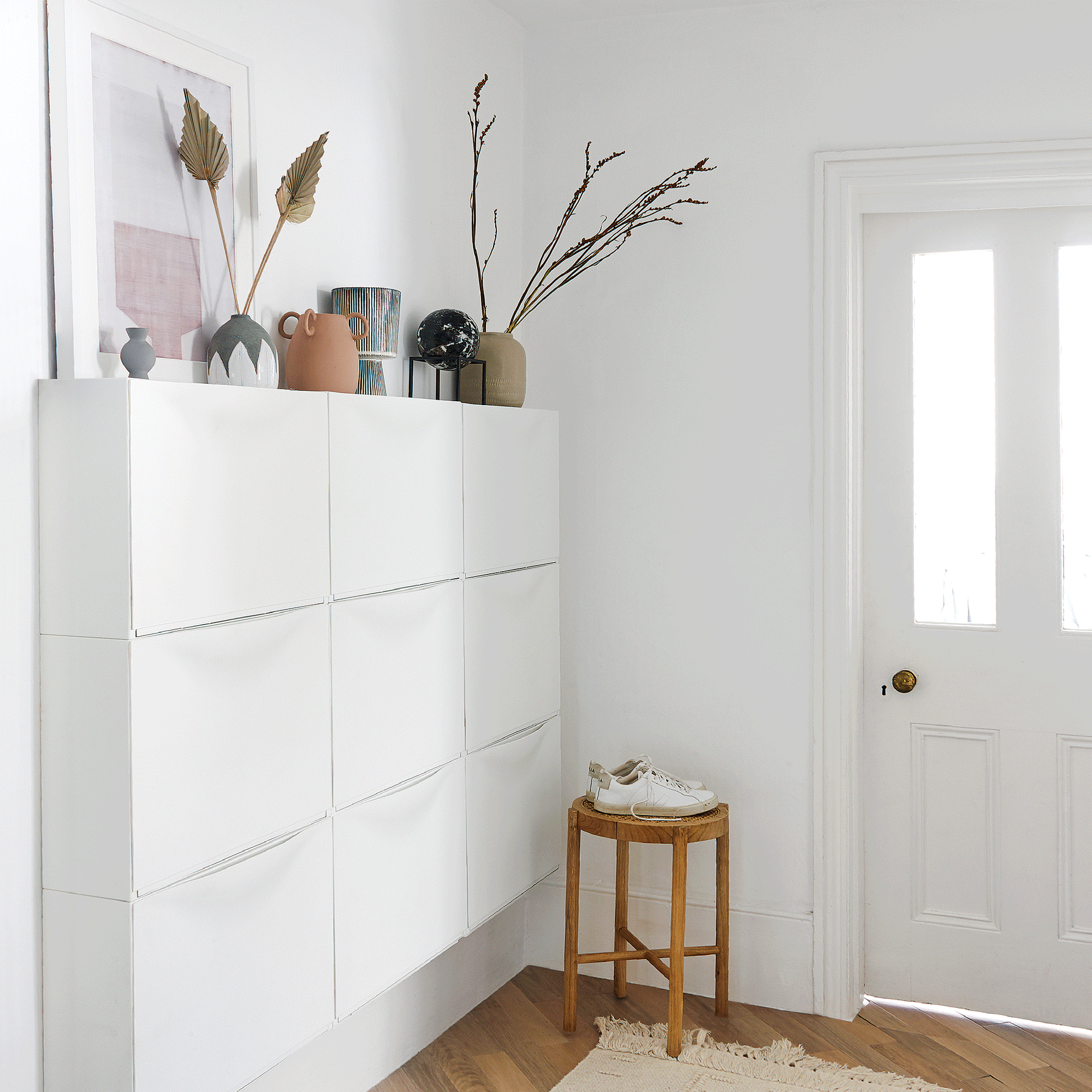 White hallway with shoe storage