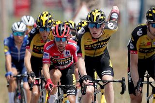 LA MANGA SPAIN AUGUST 21 Primoz Roglic of Slovenia red leader jersey and Nathan Van Hooydonck of Belgium and Team Jumbo Visma compete during the 76th Tour of Spain 2021 Stage 8 a 1737 km stage from Santa Pola to La Manga del Mar Menor lavuelta LaVuelta21 on August 21 2021 in La Manga Spain Photo by Gonzalo Arroyo MorenoGetty Images