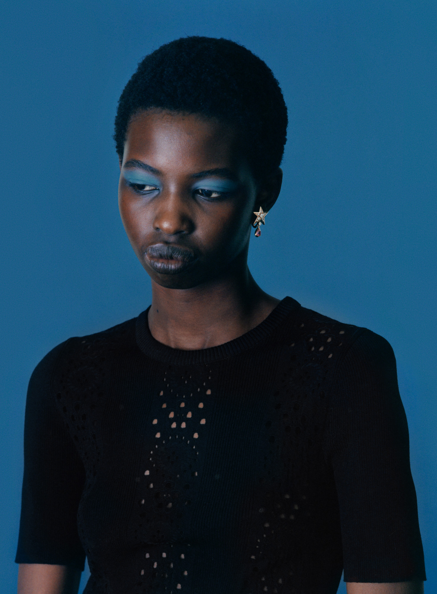 woman profile shot against blue background