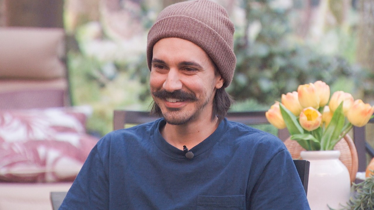 Vince smiling with a beanie on