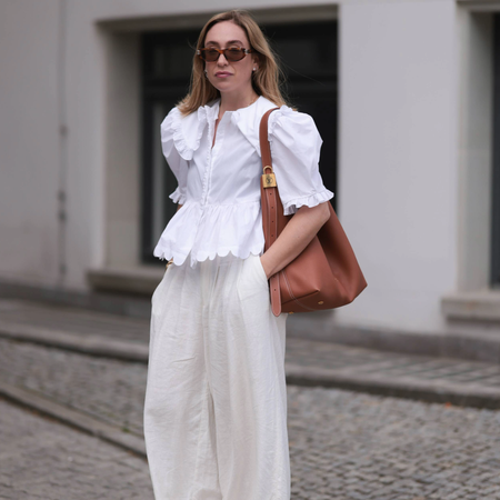 woman wearing white linen pants.